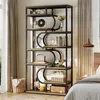 A tall, multi-shelf industrial-style bookshelf filled with decorative items and books, placed in a bedroom setting next to a bed and window. Podgląd zdjęcia produktu