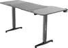 A gray adjustable height desk with black legs and feet, shown from a front-left diagonal angle against a white background. Produktbild-Vorschau