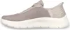 Side view of a beige Skechers slip-on sneaker. Anteprima dell’immagine prodotto