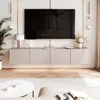 A modern living room with a mounted television and a floating media console. Produktbild-Vorschau