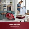 A woman is ironing clothes in a room with shelves and furniture. Anteprima dell’immagine prodotto