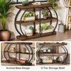 Collage of images showing a rustic industrial console table with a curved metal frame and wooden shelves, displayed in different angles and with various decorative items. Podgląd zdjęcia produktu