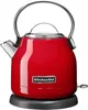 A red KitchenAid electric kettle on a gray base. Produktbild-Vorschau