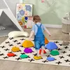 A child is playing with colorful stepping stones on a rug in a room. Náhľad obrázku produktu