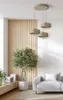 A modern living room with a pendant light fixture, a sofa, and a potted plant. Produktbild-Vorschau