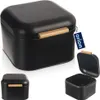 A collage of images showing a black bread bin with a wooden handle. One image shows the bread bin closed, another shows it open, and a third shows a smaller version of the bread bin. Produktbild-Vorschau