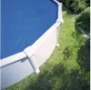 A round swimming pool with a blue solar cover, situated on a grassy lawn next to some bushes. Produktbild-Vorschau