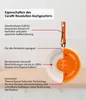 A cutaway view of an orange frying pan with descriptive text labels pointing to its features. Produktbild-Vorschau