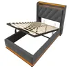 A bed frame with its mattress support raised, showing the storage space underneath. Produktbild-Vorschau