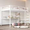 A white metal loft bed with a desk and shelves underneath, set up in a room with a pink ottoman and a round rug on the floor. Náhled obrázku produktu