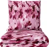 A folded duvet and a pillow with a floral pattern. Produktbild-Vorschau