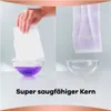 A split image showing a hand holding a white absorbent pad over a bowl of purple liquid on the left, and a purple absorbent pad hanging over a bowl of clear liquid on the right. Text below reads 'Super saugfähiger Kern'. Náhled obrázku produktu