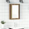 A bathroom cabinet with a mirror is mounted on a tiled wall above a sink with a faucet. Voir les images du produit