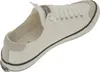 A single white canvas sneaker shown from a side-diagonal angle. Voir les images du produit