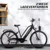 An electric bicycle is shown plugged into a charger against a white wall with shadows. Produktbild-Vorschau