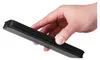 A hand is holding a black smartphone case with a carbon fiber texture. Produktbild-Vorschau