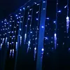 Blue icicle-shaped string lights hanging in the dark. Produktbild-Vorschau