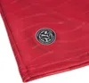 A close-up of a red football jersey with a circular badge. Produktbild-Vorschau