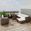An outdoor lounge set on a wooden deck with a cityscape in the background. Produktbild-Vorschau