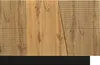 A close-up view of a modern sideboard with a geometric design, featuring wood-grain panels and black base. Produktbild-Vorschau