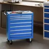 A blue rolling tool chest with drawers is shown in a workshop or garage setting. Náhled obrázku produktu