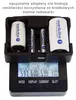 A black battery charger with four battery slots and a digital display showing charging information. Anteprima dell’immagine prodotto