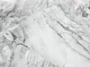 A roll of marble-patterned adhesive film. Produktbild-Vorschau