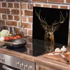 A kitchen counter with a stove, cooking utensils, and ingredients. Produktbild-Vorschau