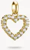A close-up studio shot of a gold heart-shaped charm pendant with clear stones, set against a plain white background. Voir les images du produit