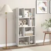 A white bookshelf filled with decorative items and books, placed in a room with a floor lamp and a side table. Podgląd zdjęcia produktu