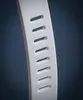 A close-up shot of a white watch strap with multiple rectangular holes. Náhled obrázku produktu