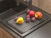 Fruits are placed on a drying rack over a sink. Podgląd zdjęcia produktu