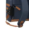 A close-up view of a navy blue backpack with brown accents, showing a smartphone placed in a zippered side pocket. Produktbild-Vorschau