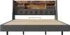 A front view of a bed frame with a headboard featuring storage compartments. Produktbild-Vorschau