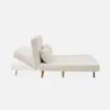 A cream-colored sofa bed shown from the side, with one section extended to demonstrate its convertible function. Produktbild-Vorschau