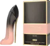 A perfume bottle shaped like a high heel and its packaging are displayed against a white background. Podgląd zdjęcia produktu