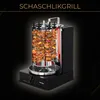 A black electric rotisserie grill with skewers of meat and vegetables is shown against a dark background. Náhled obrázku produktu