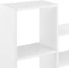 A close-up view of a white modular shelving unit. Voir les images du produit