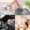 Collage of four images showing a cordless vacuum cleaner being used in different scenarios: compressing bedding, inflating a yoga ball, cleaning a car interior, and cleaning kitchen cabinets. Produktbild-Vorschau