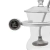 A close-up of a silver coffee siphon with a black and gold logo. Náhled obrázku produktu