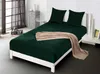 A bed with dark green bedding and a beige throw blanket. Náhled obrázku produktu