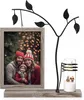 A family photo frame with a candle holder on a shelf. Produktbild-Vorschau