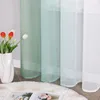 A close-up view of sheer curtains with a gradient effect, featuring tulips in a vase. Produktbild-Vorschau