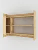 A wooden shelf unit with a cabinet door and hooks, mounted on a white wall. Podgląd zdjęcia produktu
