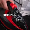 A close-up of a person pouring water into a steam iron. Produktbild-Vorschau