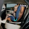 A young girl is sitting in a car seat in the back seat of a car. Náhled obrázku produktu