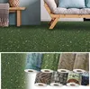 A collage showing a roll of green grass-like flooring with small white flowers, and other rolls of flooring with different patterns like water, wood, brick, and stone. Produktbild-Vorschau