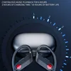 Close-up of black wireless earbuds with red accents, placed in front of their charging case, against a dark blue background with a circular graphic indicating battery life. Produktbild-Vorschau