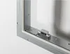 A close-up view of a metal inspection door frame with a magnetic latch mechanism attached. Produktbild-Vorschau