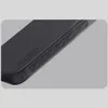 A close-up shot of a black phone case, showing its textured surface and ribbed edges. Produktbild-Vorschau